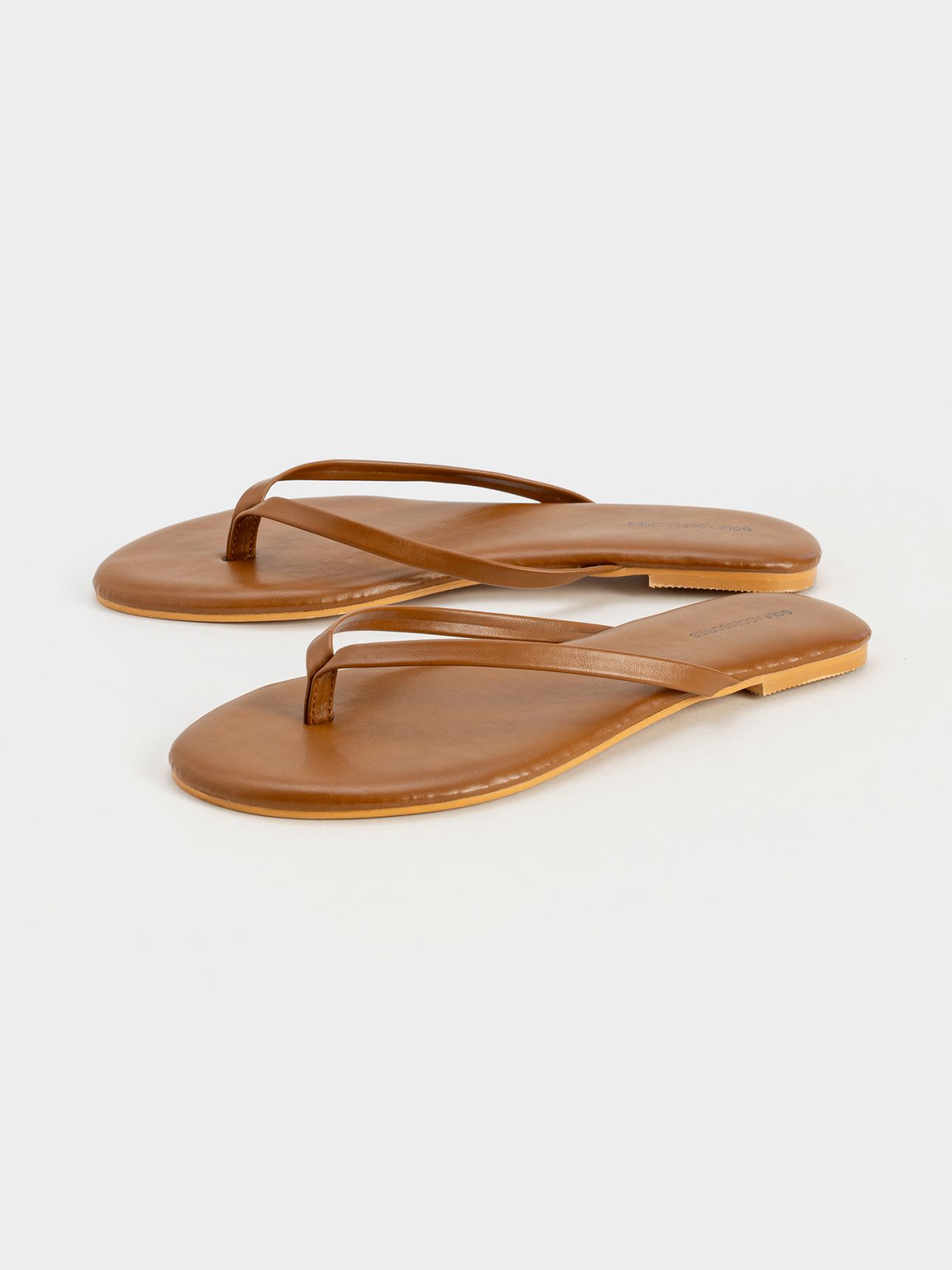 כפכפי אצבע במראה עור