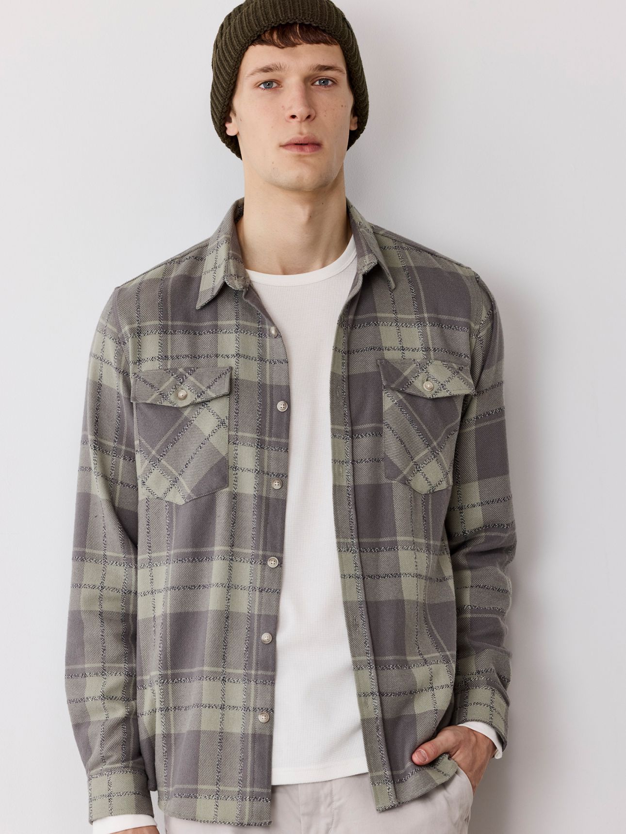 מכופתרת משובצת כיסים